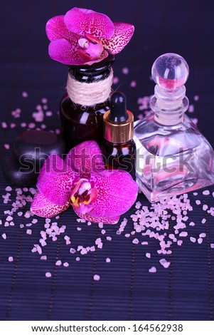 Beautiful spa setting with orchid on bamboo napkin close-up