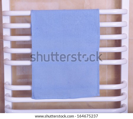 Color towel on radiator in bathroom