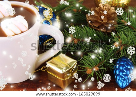 Cup of hot cacao with Christmas decorations close up