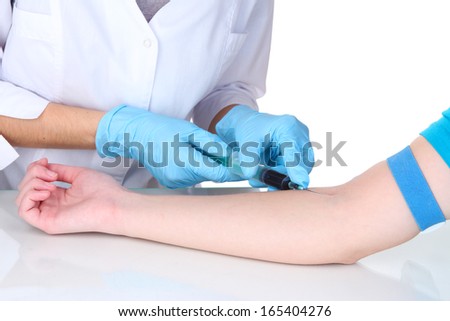 Nurse takes blood from the veins isolated on white