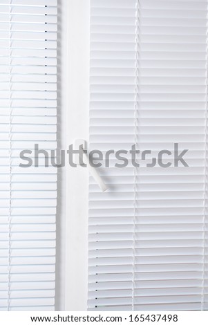 Window with white jalousie, close up