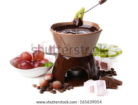 Chocolate fondue with marshmallow candies and fruits, isolated on white