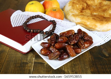 Composition with traditional Ramadan food, on wooden background