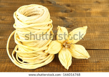 Decorative straw for hand made and flower of straw, on wooden background