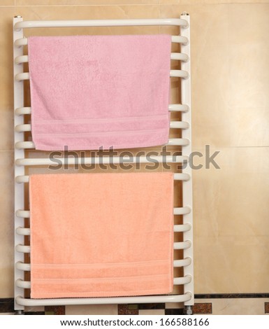 Color towels on radiator in bathroom