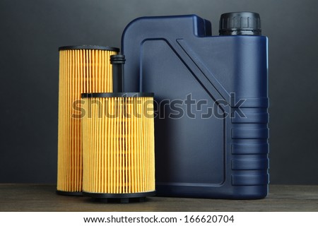 Motor oil canister on grey background