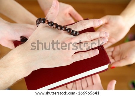 Muslim praying hands on light background