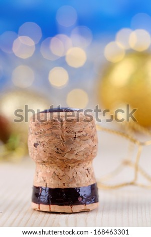 Champagne cork on Christmas lights background