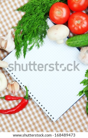 Cooking concept. Groceries with empty cookbook close up