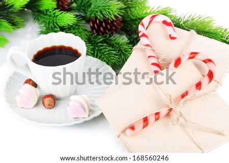 Christmas candy canes, cup with hot drink and letters for Santa, isolated on white