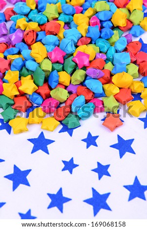 Paper stars with dreams on table close-up