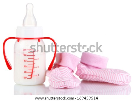 Bottle for milk formula with booties isolated on white