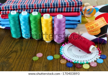 Sewing accessories on wooden table