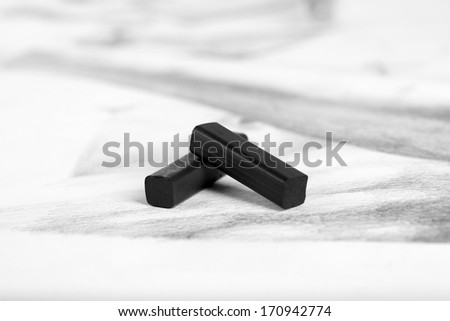 Black drawing charcoal on  picture isolated on white