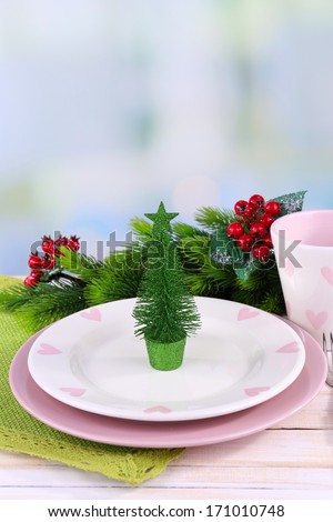 Set of utensil for Christmas dinner, on table, on light background