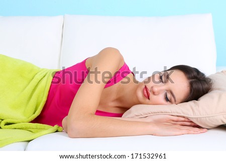 Beautiful Young Woman Sleeping On Sofa Close Up