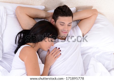 Couple in love sleeping in bed