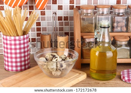 Cooking food in kitchen on table on mosaic tiles background
