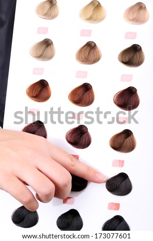 Hair stylist with hair samples of different colors, close-up