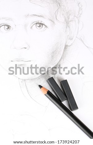 Black drawing charcoals and pencil on picture isolated on white