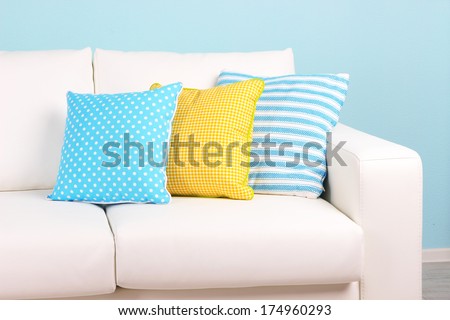 White Sofa Close-Up In Room On Blue Background