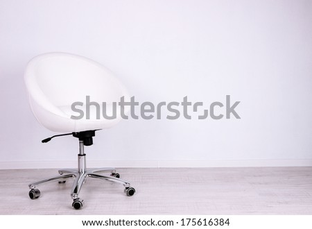 Modern chair in room on white background