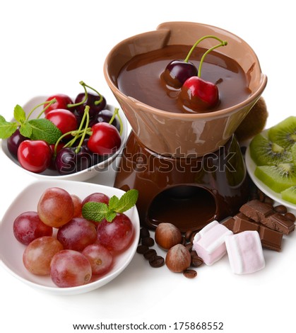 Chocolate fondue with marshmallow  and fruits, isolated on white