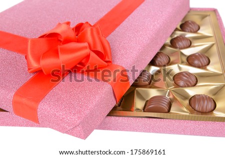 Delicious chocolates in box close-up