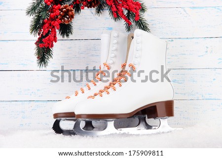 Figure skates on wooden background