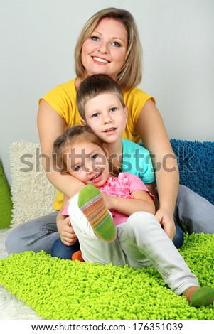 Little children with mom in room