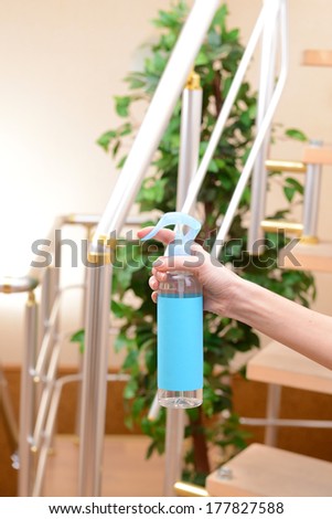 Sprayed air freshener in hand close-up
