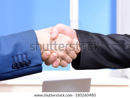 Business partners joining their hands