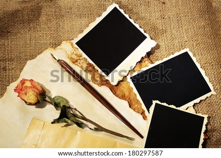 Composition with blank old photos, paper, letters on sackcloth background