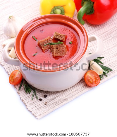Tasty tomato soup and vegetables, isolated on white