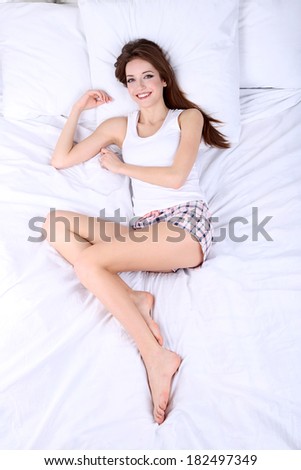 Young beautiful woman woke up in bed close-up