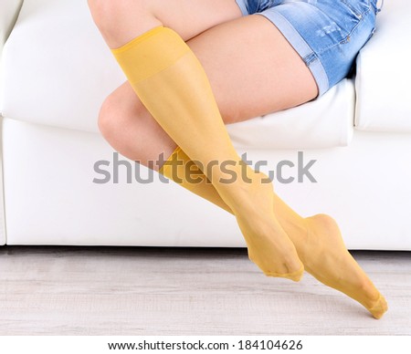 Socks on perfect woman legs, close up