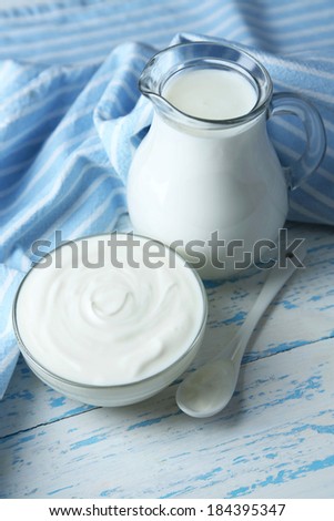 Dairy products on wooden table background