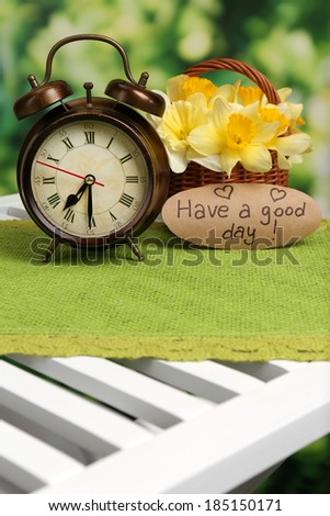 Digital alarm clock on table, on nature background
