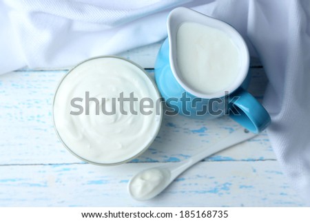 Dairy products on wooden table background