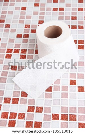 Color toilet paper roll on bright background