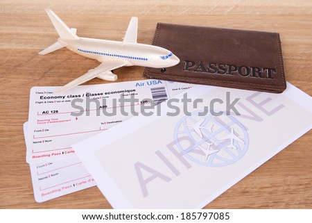 Airline tickets with passport on table close-up