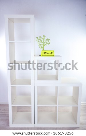 New white shelves with price on light background