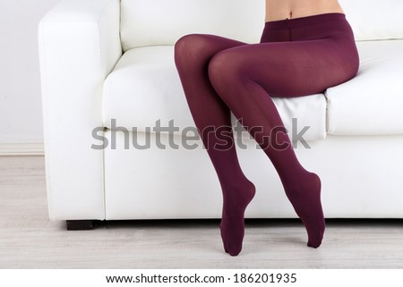 Stockings on perfect woman legs, close up