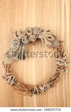 Beautiful rustic wreath, on wooden background