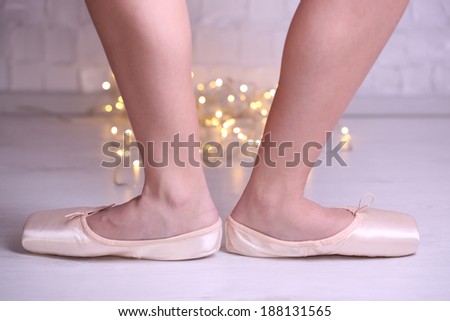 Ballerina in pointe shoes  in dance hall