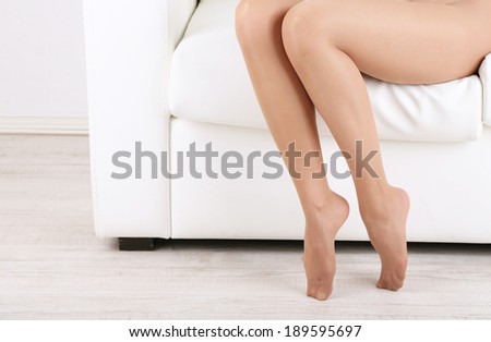 Stockings on perfect woman legs, close up