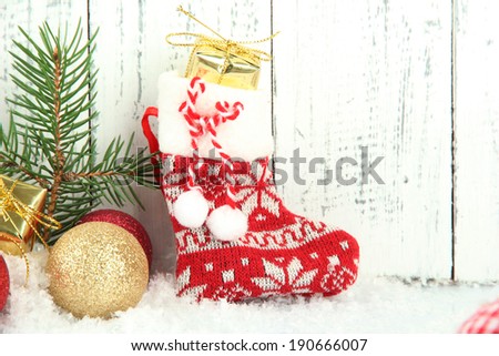 Beautiful Christmas composition with Santa sock on wooden background
