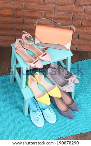 Shoe shelf with women shoes and fashion bag