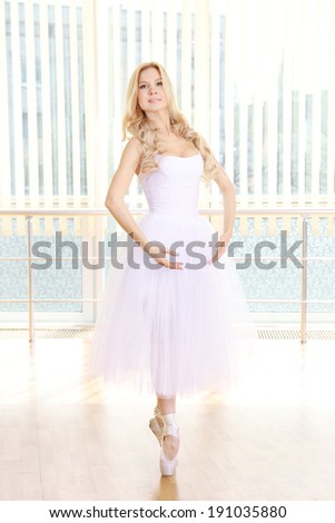 Beautiful balerina dancing in ballet class