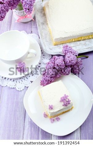Delicious dessert with lilac flowers